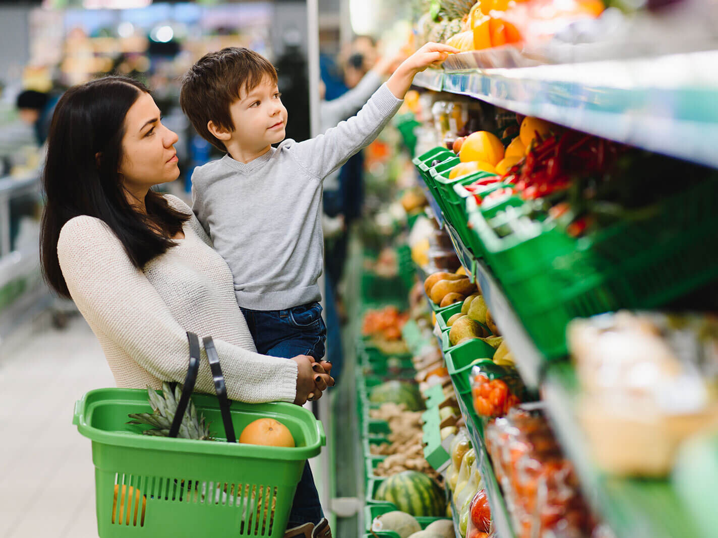 mother and daughter shopping at supermarket